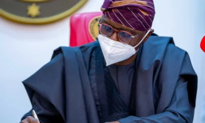 Governor Sanwo Olu of Lagos state signing a document e1736432578953.webp